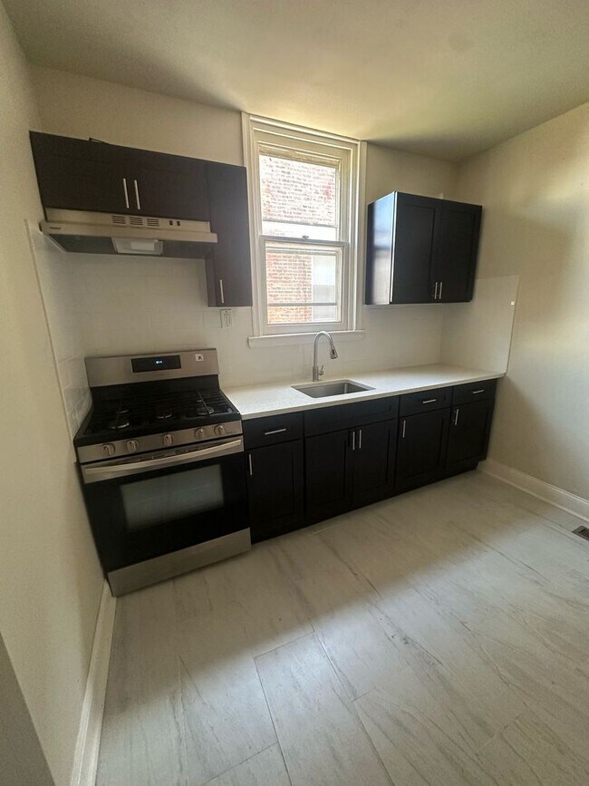 Building Photo - BRAND NEW 2 BEDROOM 1 BATH FIRST FLOOR APARTMENT
