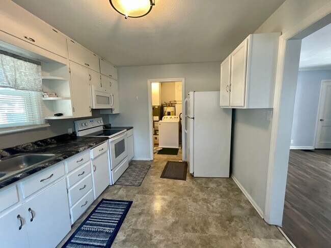 Building Photo - Farrington Grove 2 bdrm, 1 bath Beauty – Fenced Yard + Garage!