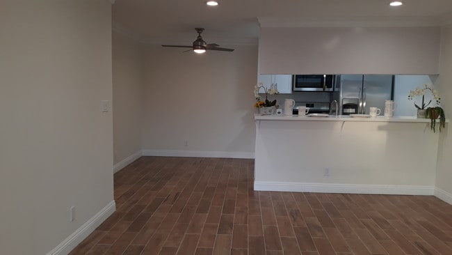 Wood like ceramic tile flooring,ceiling fan d - 4727 W 147th St