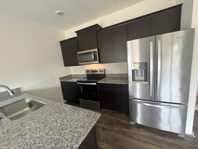 Building Photo - Brand New Townhome – Modern Comfort & Conv...