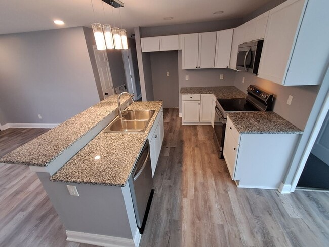 Building Photo - COMING SOON: Fully Renovated, Full of Charm — Space, Style, and a Porch Swing Vibe