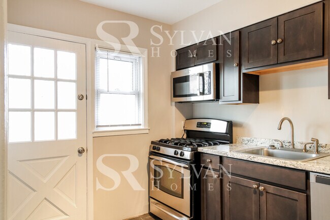 Building Photo - Turn the key. Enter. Smile. Repeat every day!