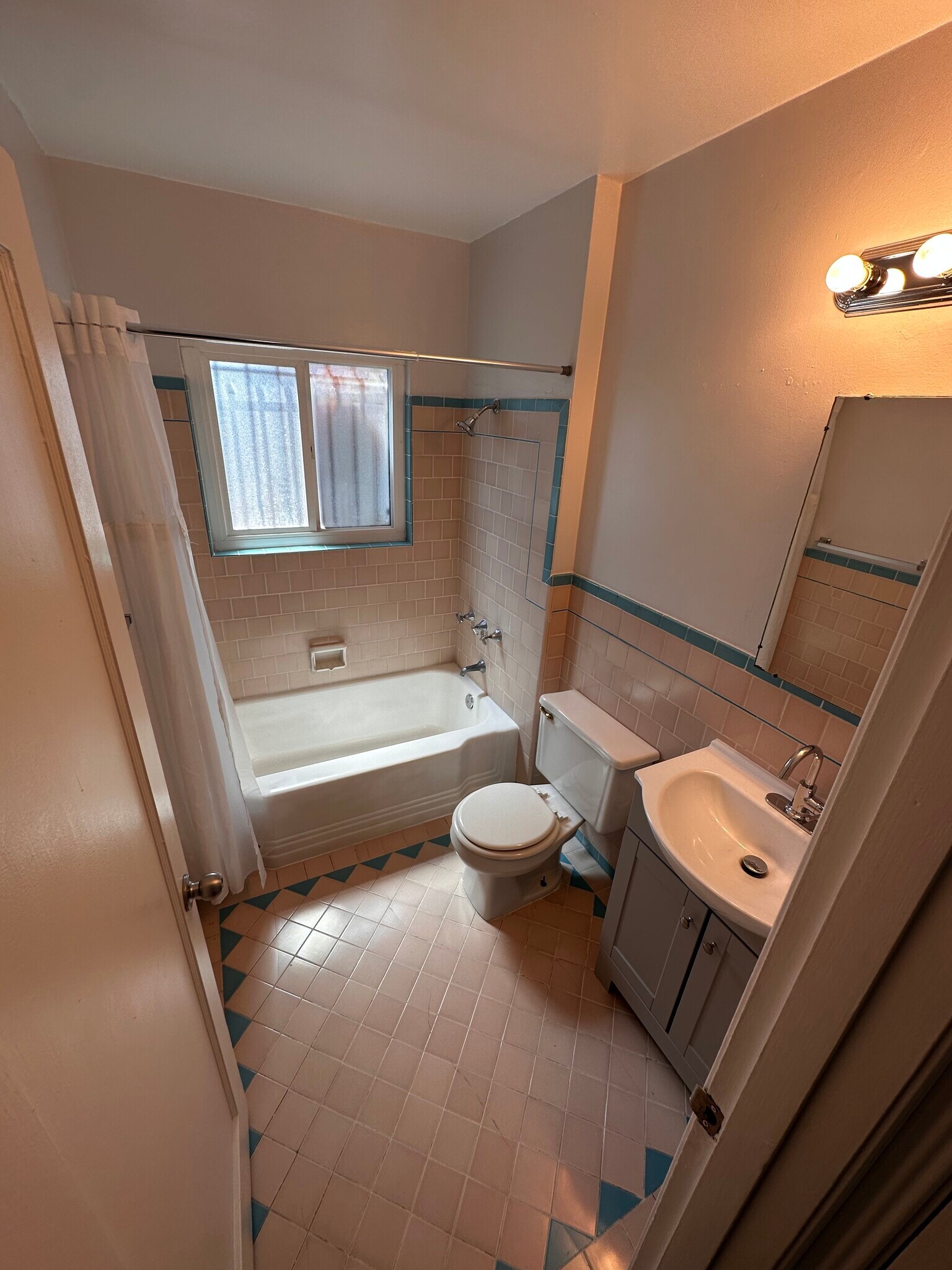 Bathroom update with new Faucet and Cabinet, Tub repainted and new shower head - 6333 MacArthur Blvd