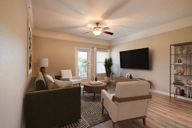 Spacious Living Room with Hardwood-Style Flooring - Carrington at Champion Forest Apartments