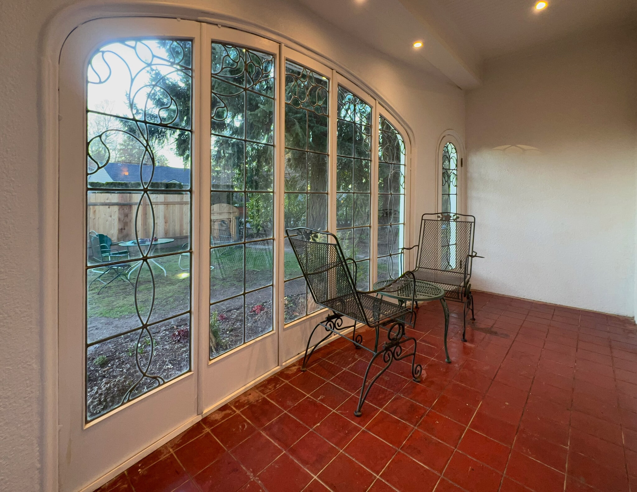 Unique sunroom has original stained glass windows and doors. - 3448 SW Canby St