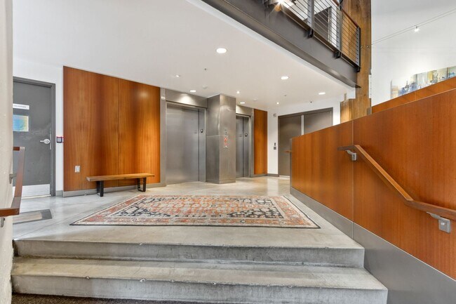 Building Photo - Chic, urban studio condo in the Pearl—Peaceful, In-unit w/d, 14-ft ceilings, deeded parking