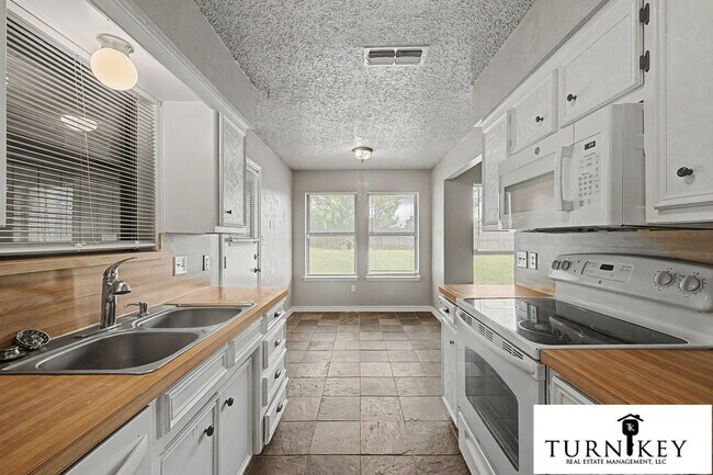Building Photo - Cozy 3/2 Burleson Charmer | Wood-Burning Fireplace | 2-Car Garage | Pet-Friendly