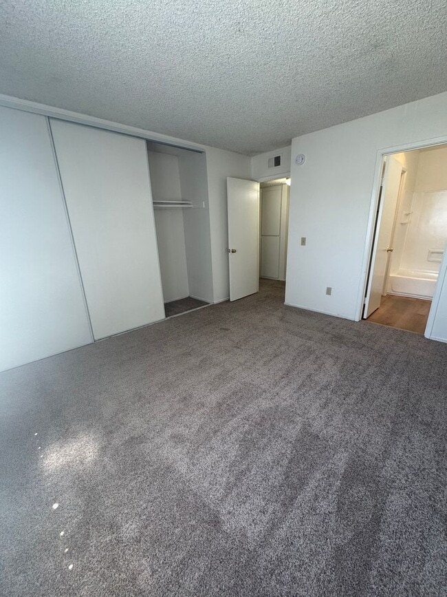 Building Photo - Upstairs two-bedroom 1/12 bath condo avail...