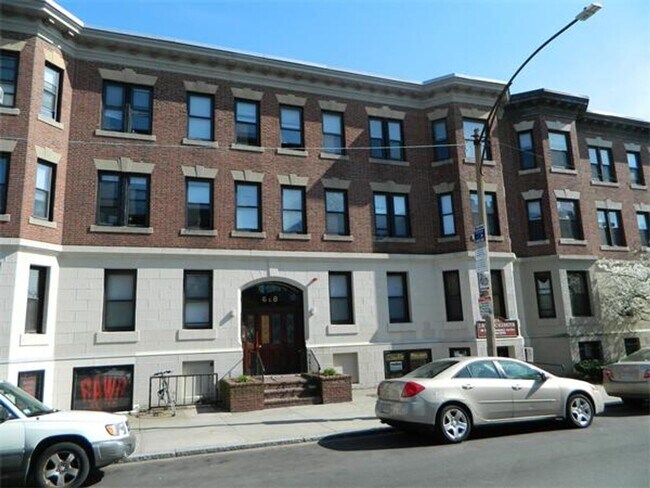 Building Photo - Large 5 bedroom, 2 full baths, right on the T!