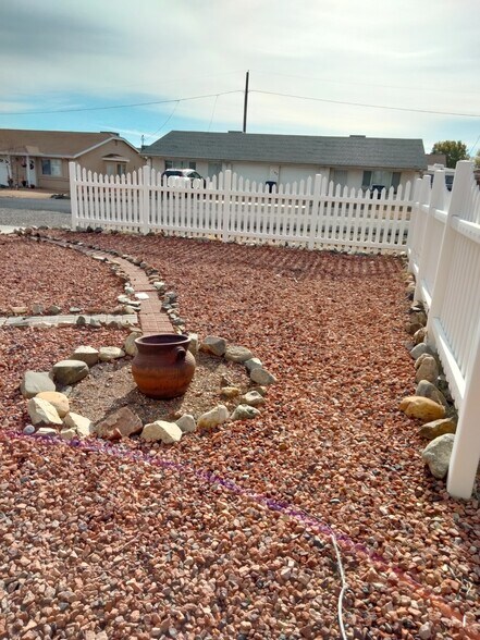 Courtyard in the front behind the picket fence - 8396 E Stevens Dr