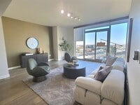 Building Photo - Gorgeous 1 Bedroom Condo at Axis with Den