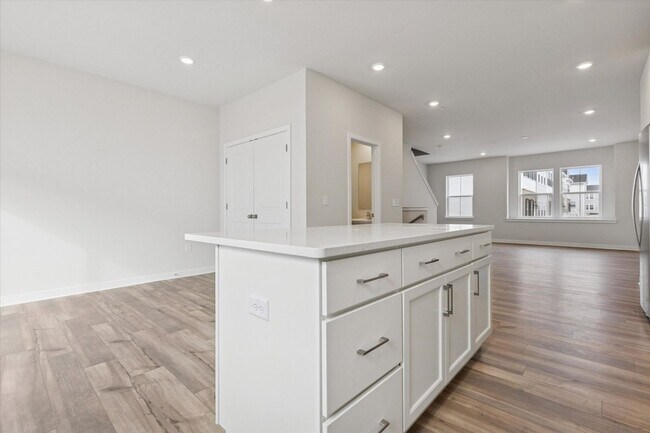 Building Photo - COMING SOON! Brand New River Pointe townhome with modern finishes, flexible living space, and a p...