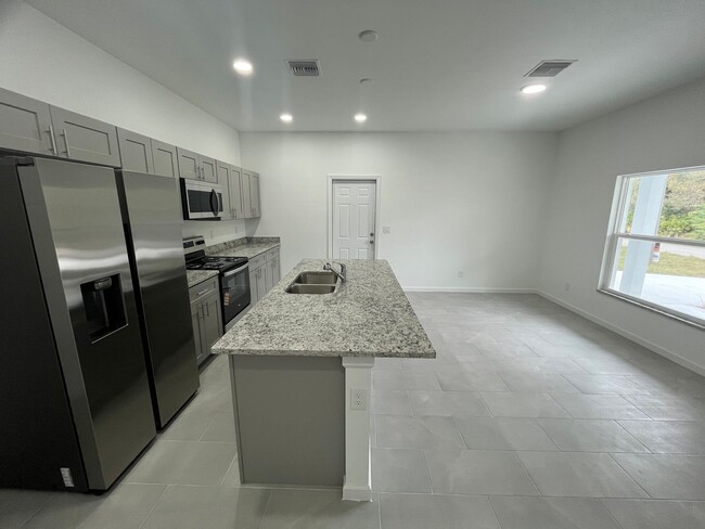 Building Photo - ONE OF A KIND! BRAND NEW 1 Bedroom-1 Bath- 1 Car Garage in Desirable Lehigh Acres!