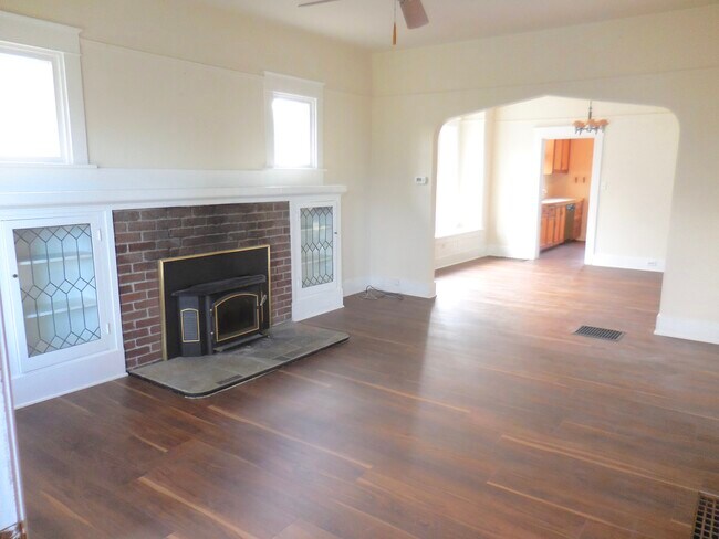 Beautiful living room with wonderful architectural details & wood burning fireplace - 4626 N Mullen St