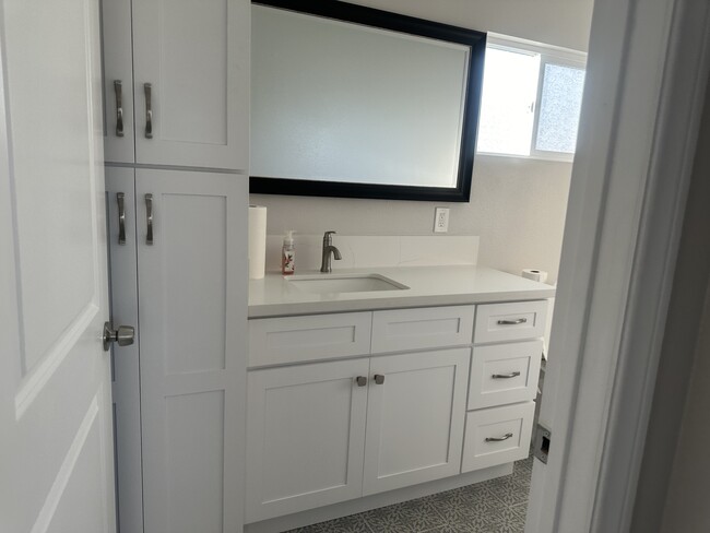 Bathroom with storage - 5508 W 117th St