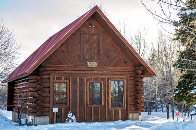 Building Photo - Charming Log Cabin and Carriage House – Do...