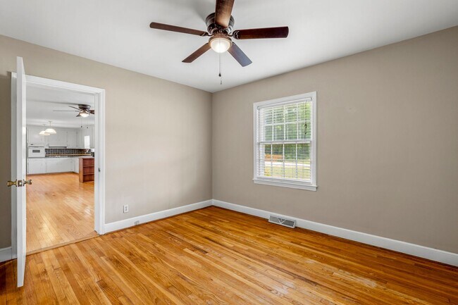 Building Photo - Large Renovated Ranch Home, Two Kitchens & Two Living Areas, Hardwood Flooring, Deck, Fenced!