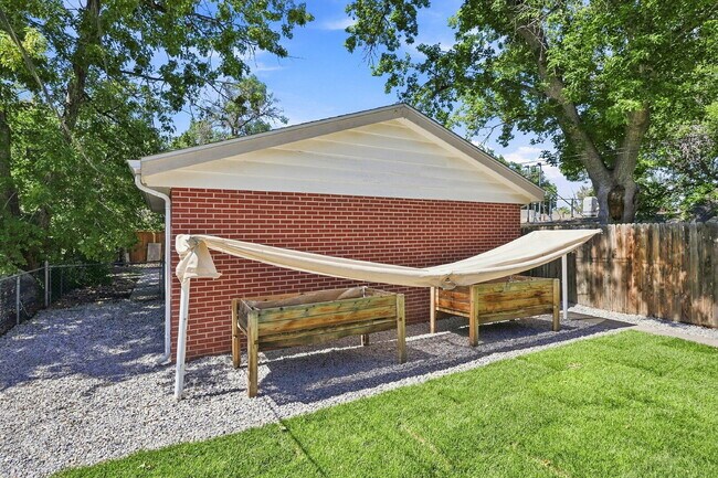 Building Photo - AVAILABLE NOW  Spacious 4-Bedroom Wheat Ridge Home with Finished Garden Level, Two-Car Garage & B...