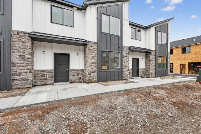 Building Photo - $300 off first month for February move-ins - BRAND NEW 3 BED 2.5 BATH TOWNHOMES WITH 2 CAR GARAGE