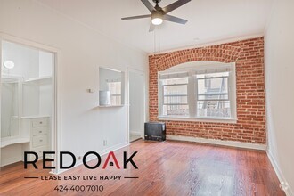 Building Photo - Welcoming Studio with Exposed Red Brick, H...