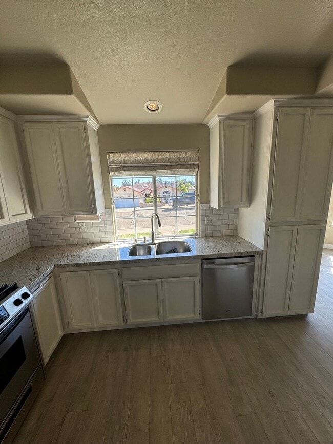 Building Photo - 4-Bedroom Home with Updated Kitchen and Co...