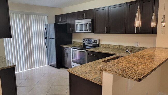 Building Photo - WINTER PARK: Goldenrod Condo - Ground Floo...