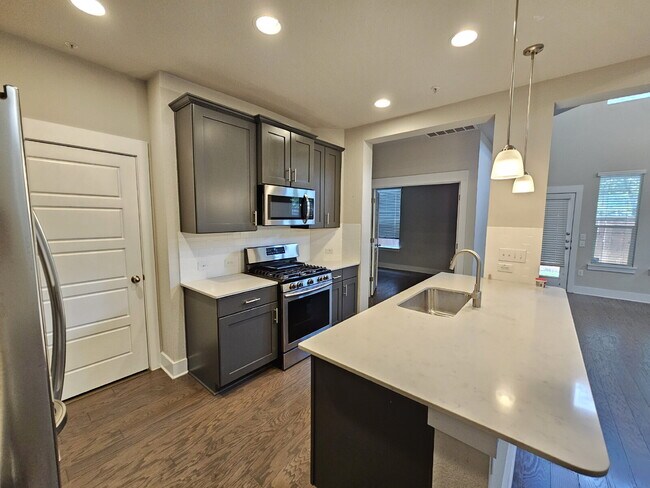 Building Photo - Experience Modern Living: Spacious 3-Bed, 3-Bath Townhome with Two Primary Bedrooms