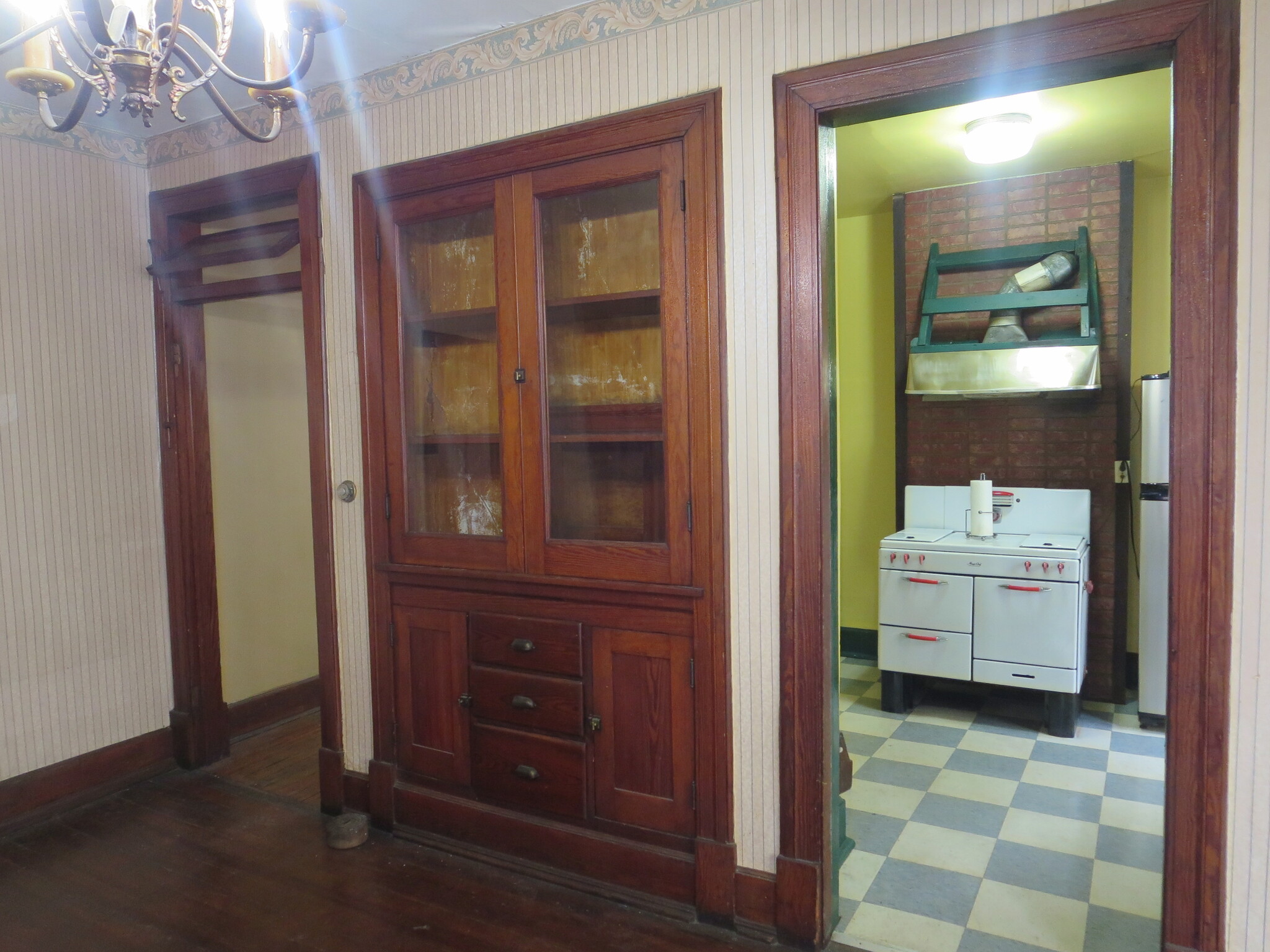 Dining Room looking at built in cabinet and kitchen. - 204 S 6th St