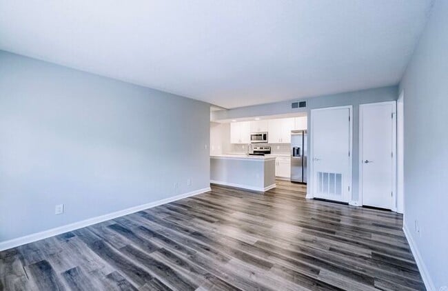 Building Photo - Spacious 2-Bedroom Elite Apartment with Private Balconies & Washer/Dryer