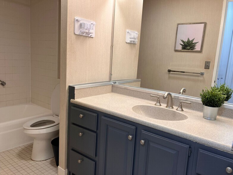 Bathroom with bath tub, shower, toilet and sink - 8200 E Jefferson Ave
