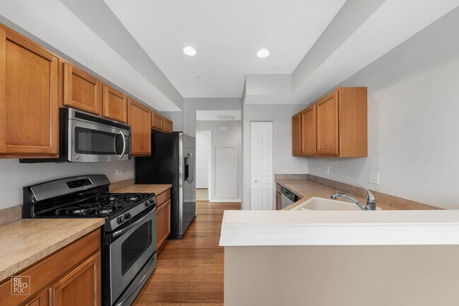 Building Photo - Yorkville First Floor End Unit Two Bed Condo with Pond Views