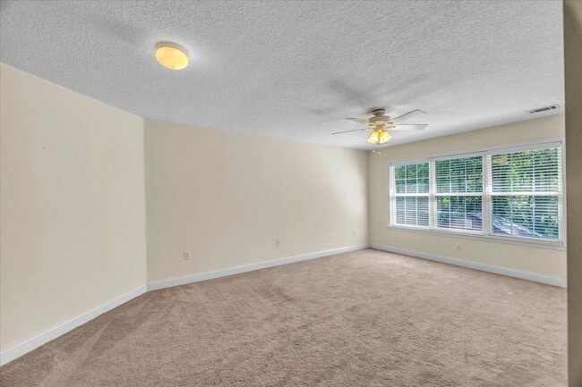 Building Photo - Stunning all-brick home on a large wooded lot