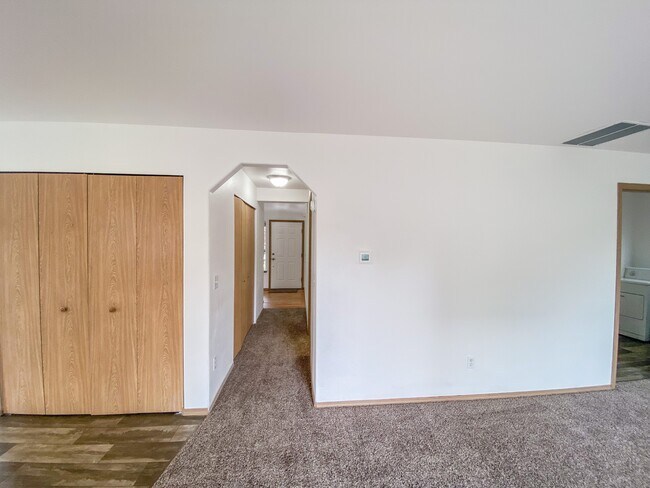 Downstairs hallway - connects entryway, bathroom, kitchen, and family room - 9010 174th Street Ct E
