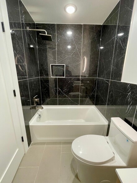 Elegant Rainfall Shower in Stylish First-Floor Bathroom - 443 Bergen Ave