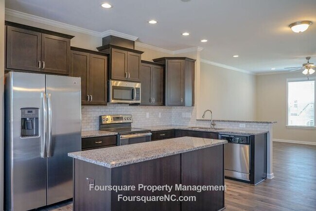Building Photo - Modern 3-Story Townhome with Entry-Level Bonus Room, Back Deck & Garage , Community Pool in North...