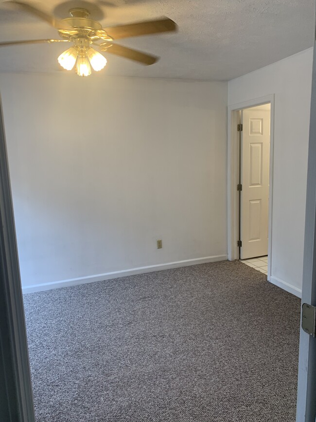 Bedroom 2 (carpet replaced with vinyl plan flooring in 2024) with attached bathroom - 1413 Loop Road