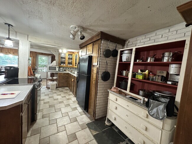 Building Photo - Peaceful Waterfront Living: 2-Story Home on River Road with Ample Outdoor Storage & Water Extras!