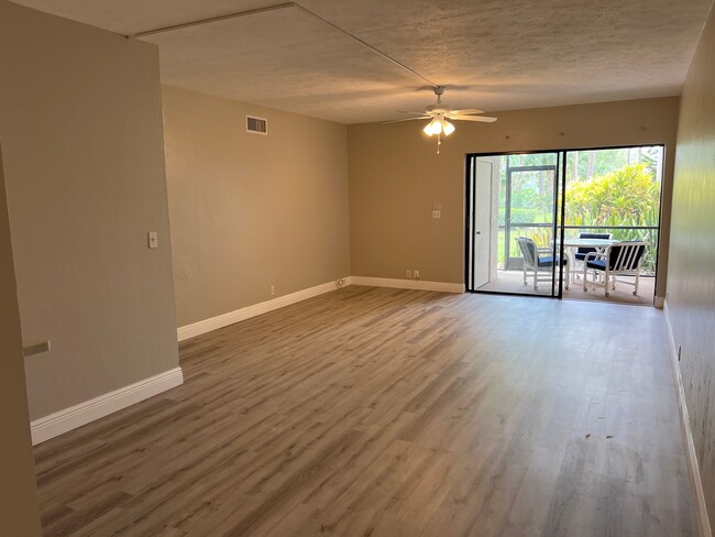 Living Room with new floors and paint - 1733 Courtyard Way