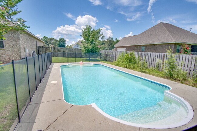 Building Photo - Spacious 4BR Pool Home with Modern Upgrade...