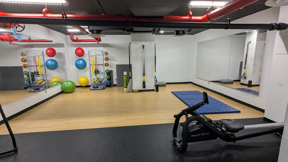 24-hour fitness center includes a rowing machine and equipment for flexibility/resistance training. - 490 M St SW