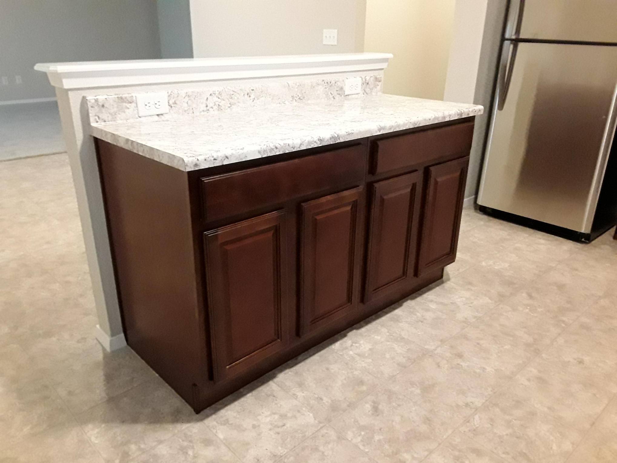 Kitchen island adds counter space and storage cabinets - 5074 W Claxton Circle