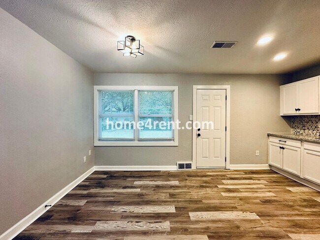 Building Photo - Lovely Three Bedroom Home in KCMO and an Updated Kitchen  w/ Granite and SS Appliances, including...