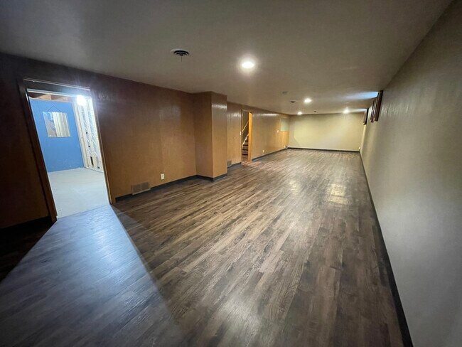 Massive family room (brand new flooring) - 1208 E 30th St