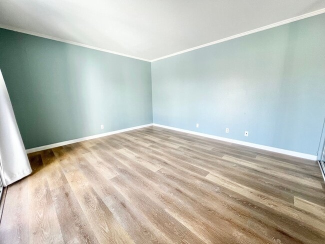 Building Photo - Contemporary 2 Bed Condo with 2 Garage Parking Spaces, Community Pool, and 3 Private Balconies