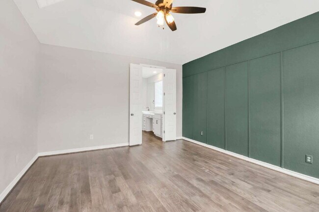 Building Photo - ASK ABOUT FREE APPLICATIONS THROUGH AUGUST!  "Spacious 4-Bedroom Sanctuary with Cozy Fireplace in...