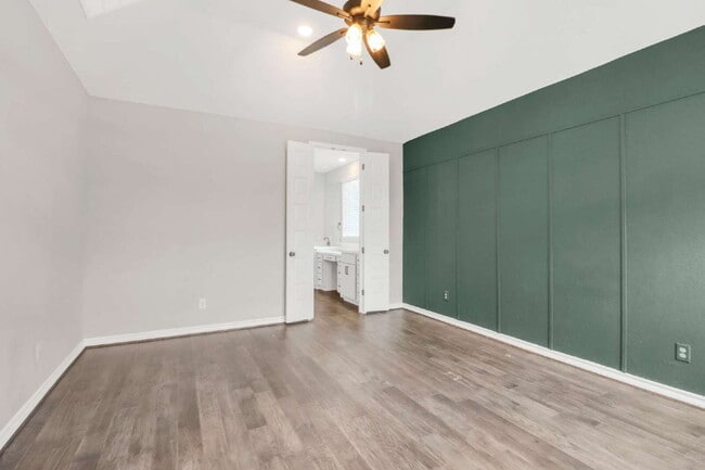 Building Photo - "Spacious 4-Bedroom Sanctuary with Cozy Fireplace in San Antonio's Prime Location!"