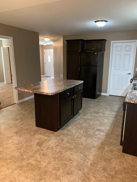 Easy kitchen access from attached two-car garage (white solid door), or front door (white door with window) - 967 1st st se