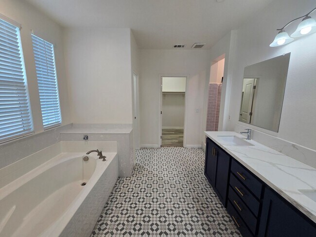 Building Photo - Open-Concept Living with Downstairs Bedroom & Enclosed Patio Retreat