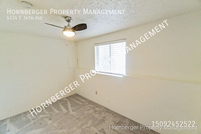 Building Photo - 4124 E 34th Ave