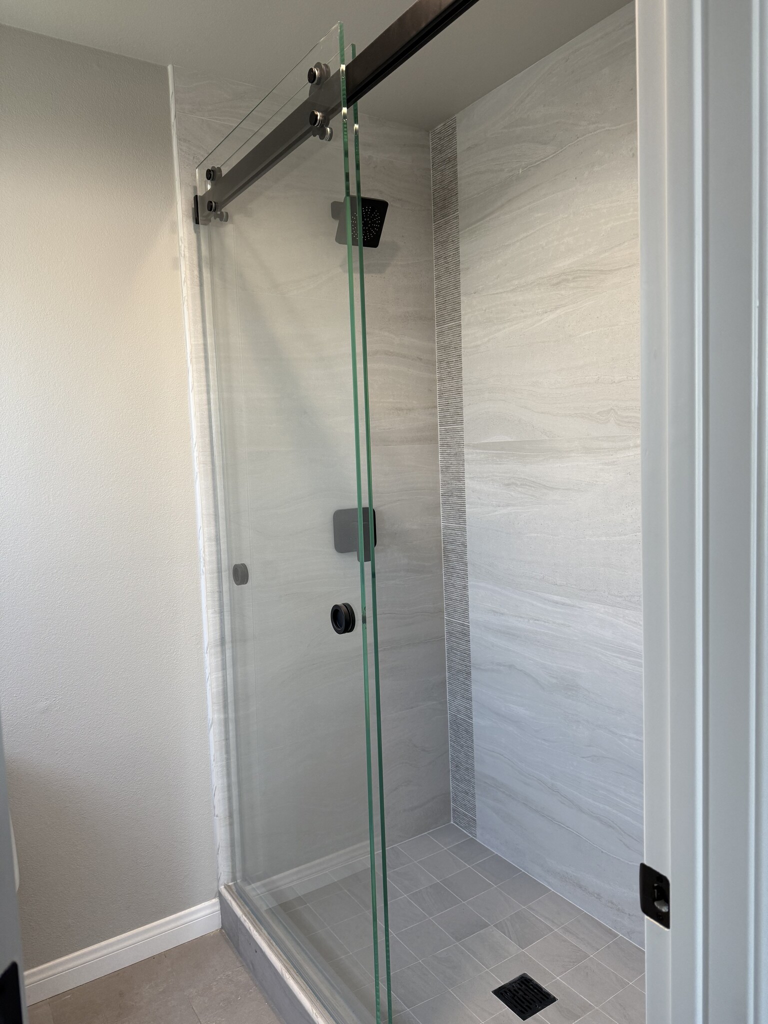 Custom sliding glass shower doors. Master bathroom shower. - 209 39th St